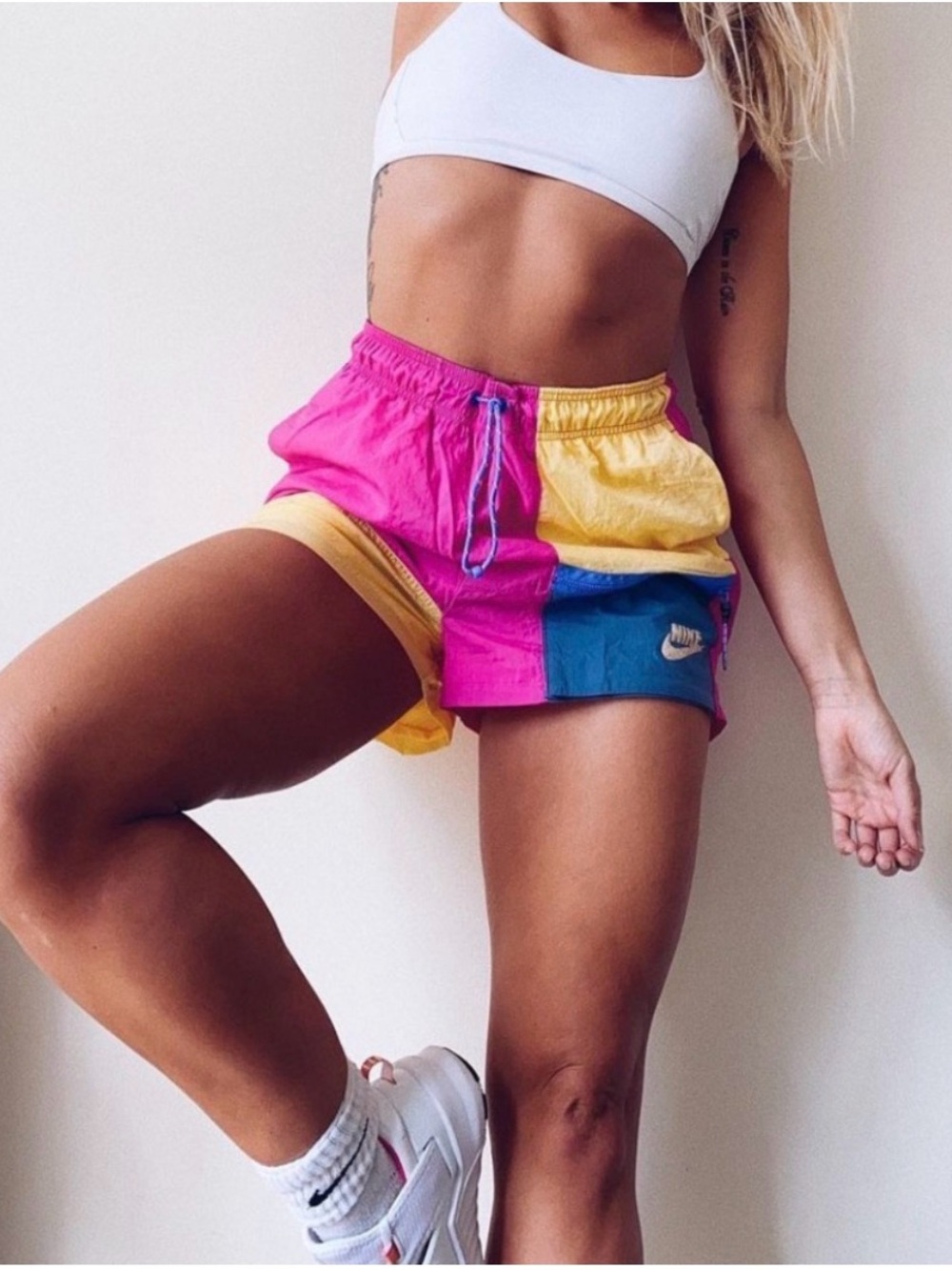 Nike XS Clash Icon colorblock high rise athletic pocketed shorts in pink yellow